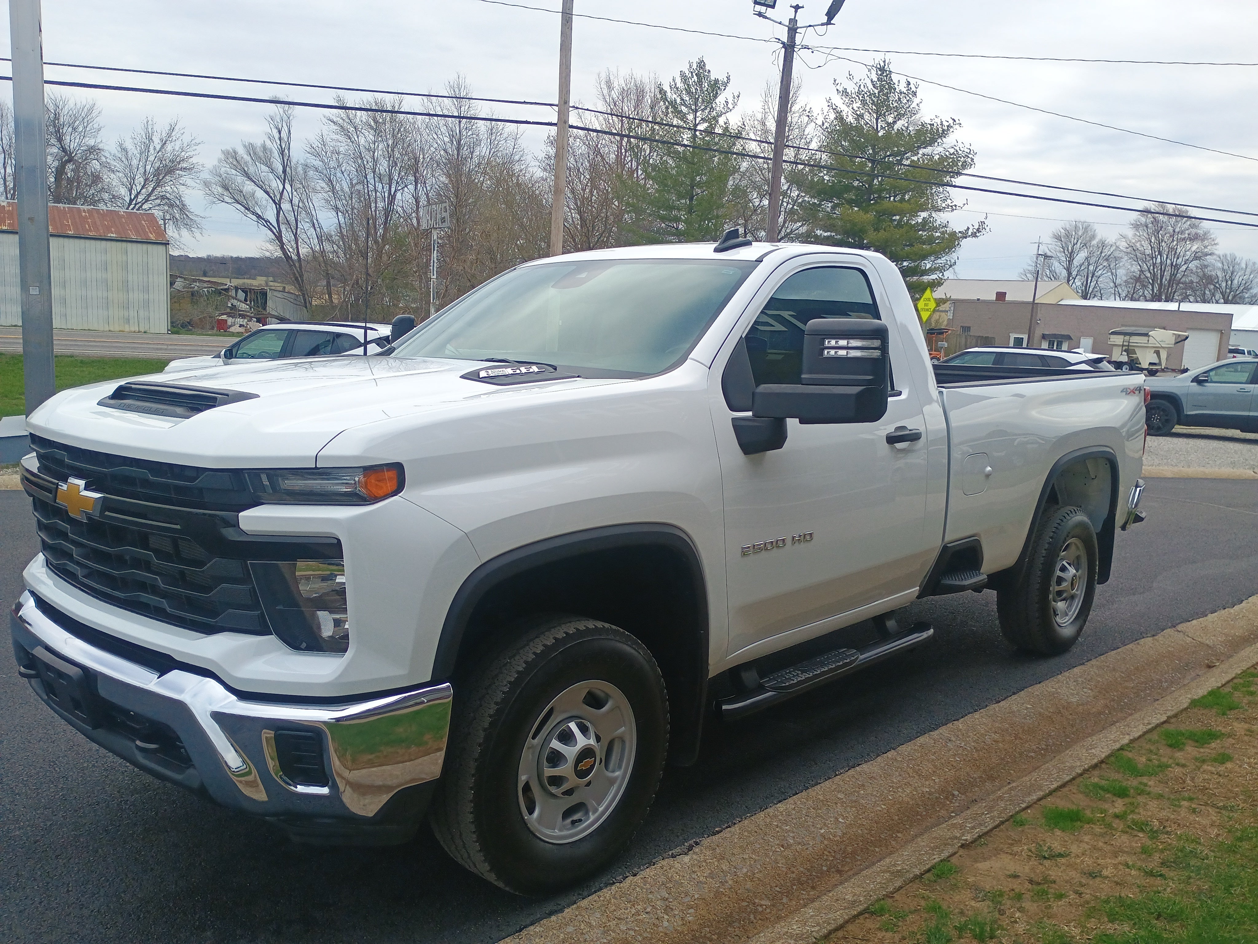 2025 Chevrolet Silverado 2500 HD WT in Summit White — front three-quarter view