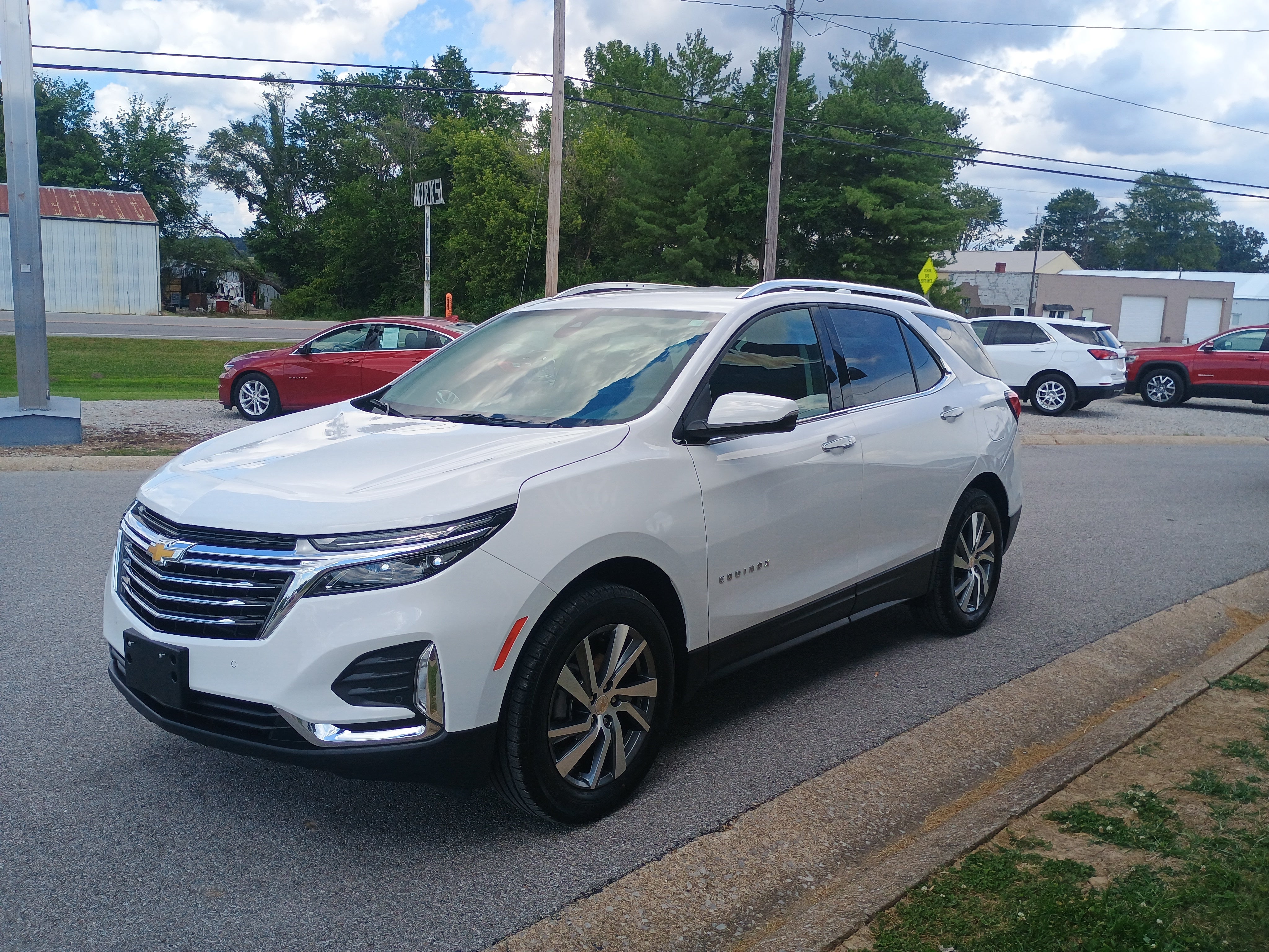 2023 Chevrolet Equinox Premier in Summit White — front three-quarter view