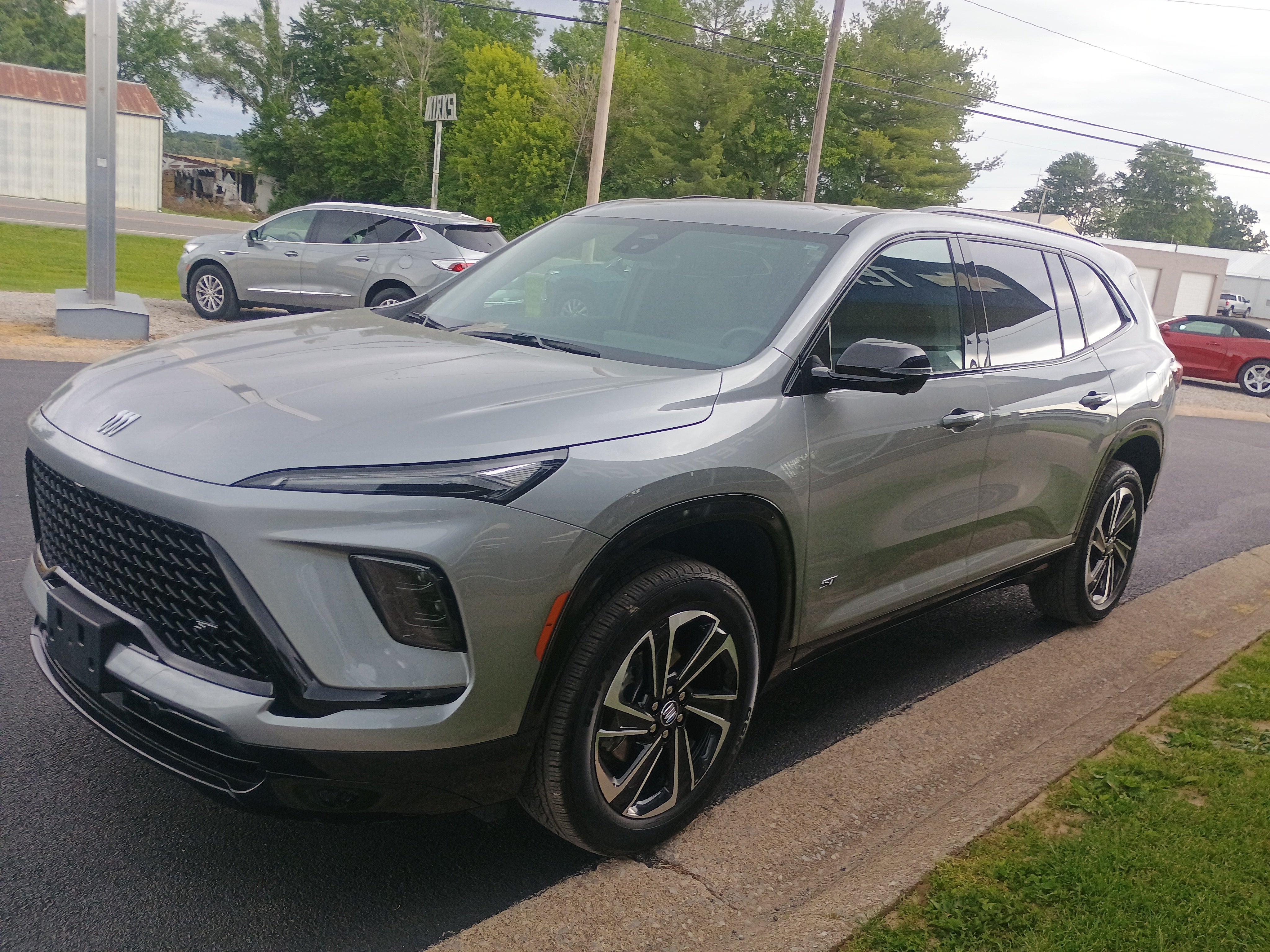 2025 Buick Enclave Sport Touring in Moonstone Gray Metallic — front three-quarter view