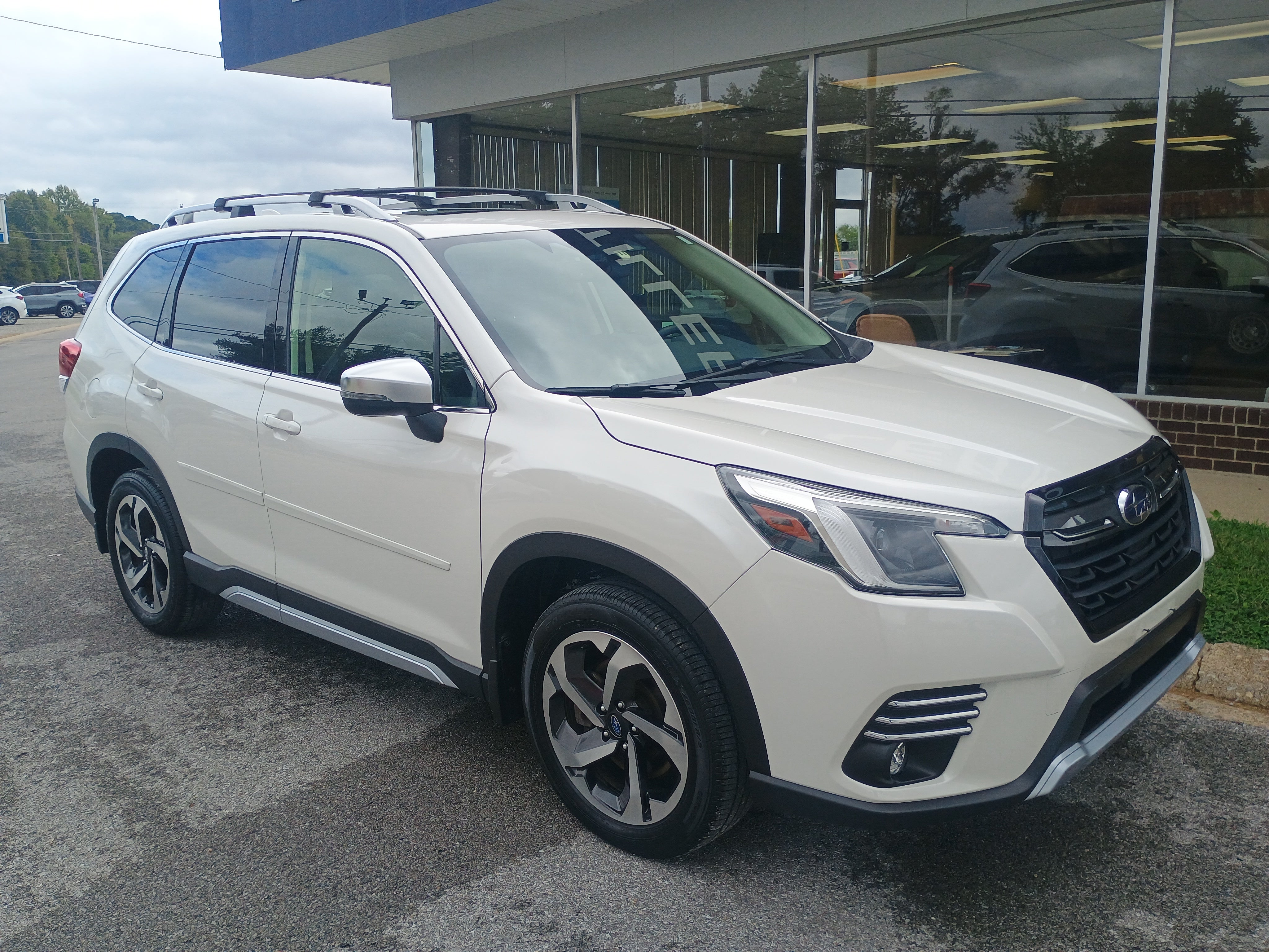 2022 Subaru Forester Touring in White — front three-quarter view