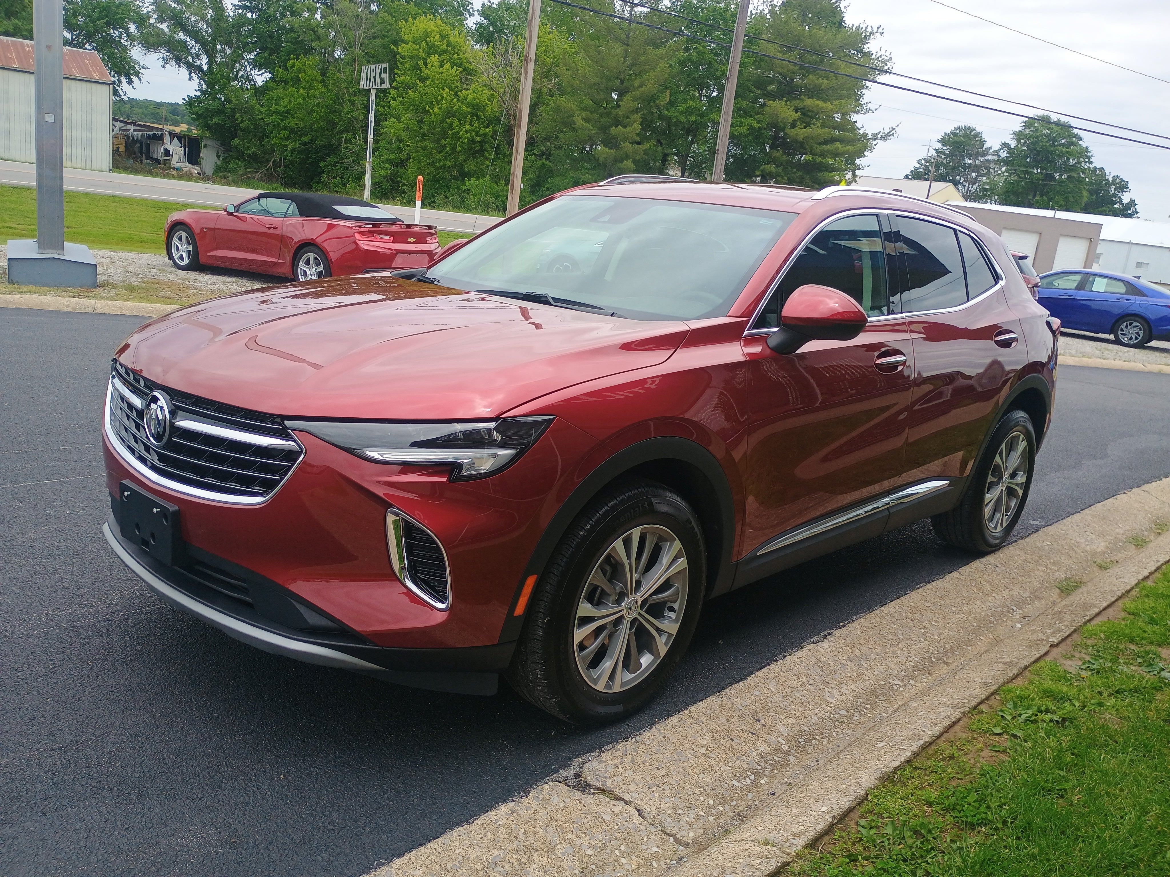2023 Buick Envision Preferred in Cinnabar Metallic — front three-quarter view